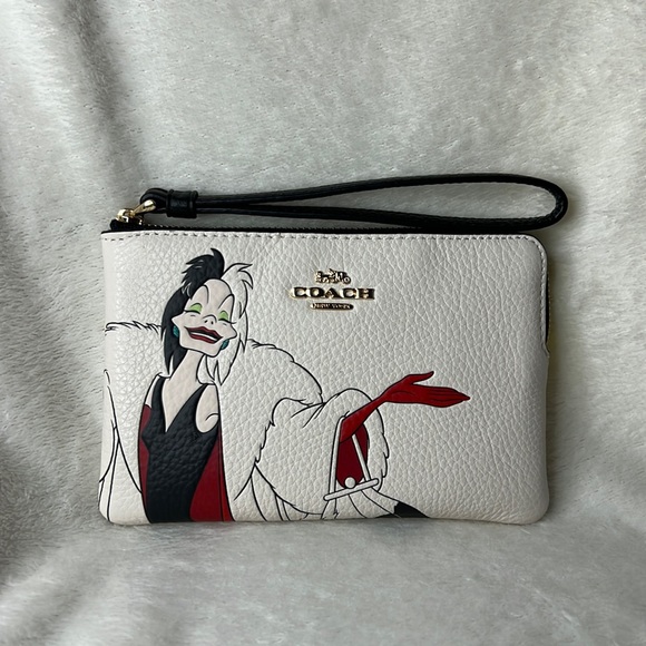Coach Handbags - NWT Disney X Coach Corner Zip Wristlet With Cruella Motif